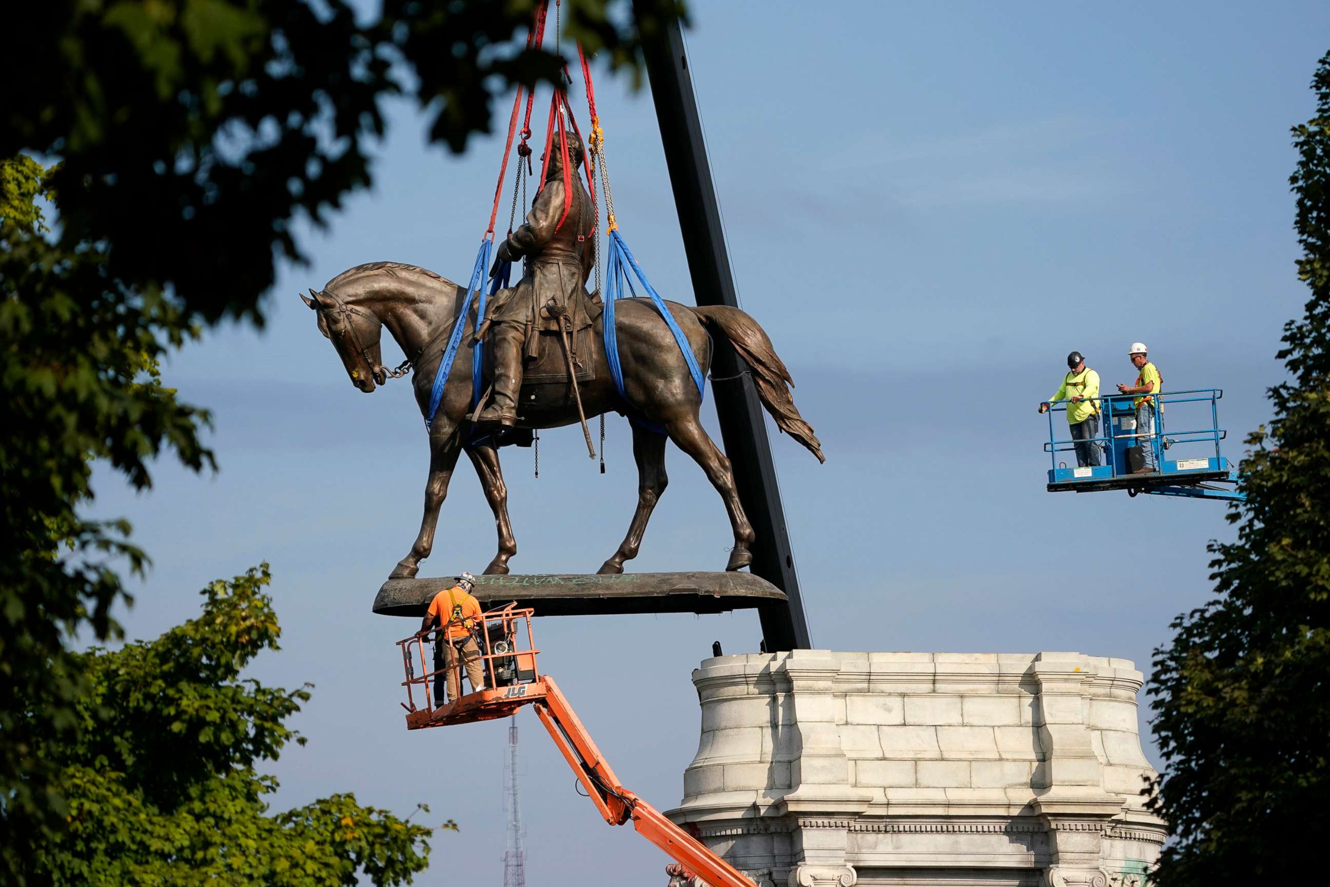 PHOTO: The statue of Confederate Gen. Robert E. Lee is removed in Richmond, Va., Sept. 8, 2021, more than 130 years after it was erected.