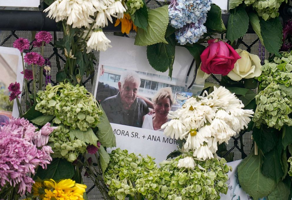 PHOTO: A photo of Juan Mora Sr. and his wife, Ana Mora hangs on the memorial wall for the victims of the Champlain Towers South building collapse in Surfside, Fla., June 29, 2021.