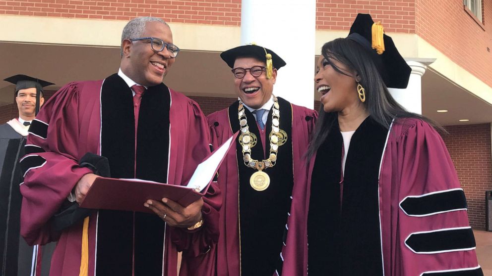 PHOTO: Robert F. Smith, left, laughs with David Thomas, center, and actress Angela Bassett at Morehouse College, May 19, 2019, in Atlanta.