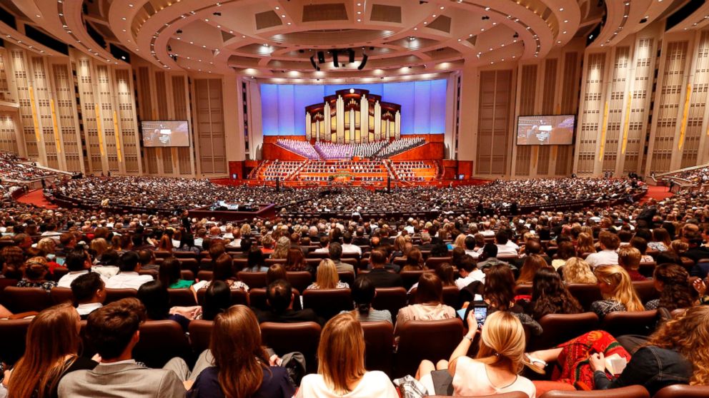 In this Sept. 30, 2017, file photo, people attend the morning session of the two-day Mormon church conference in Salt Lake City.