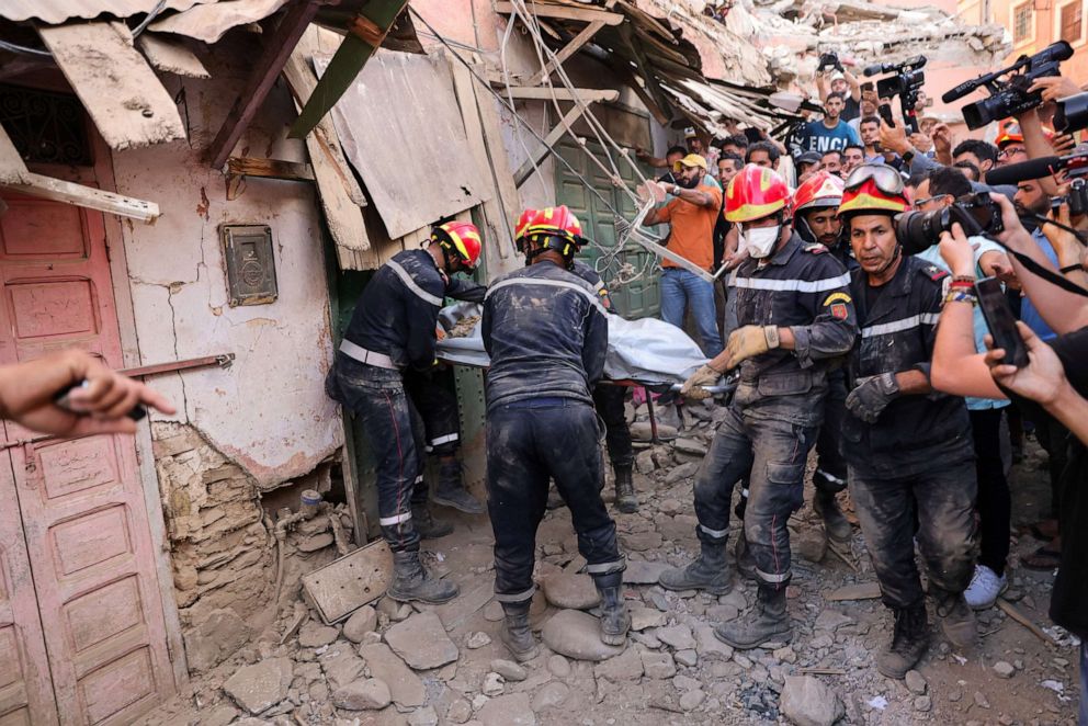 PHOTO: Emergency workers carry a dead body, in the aftermath of a deadly earthquake, in Amizmiz, Morocco, Sept. 10, 2023.