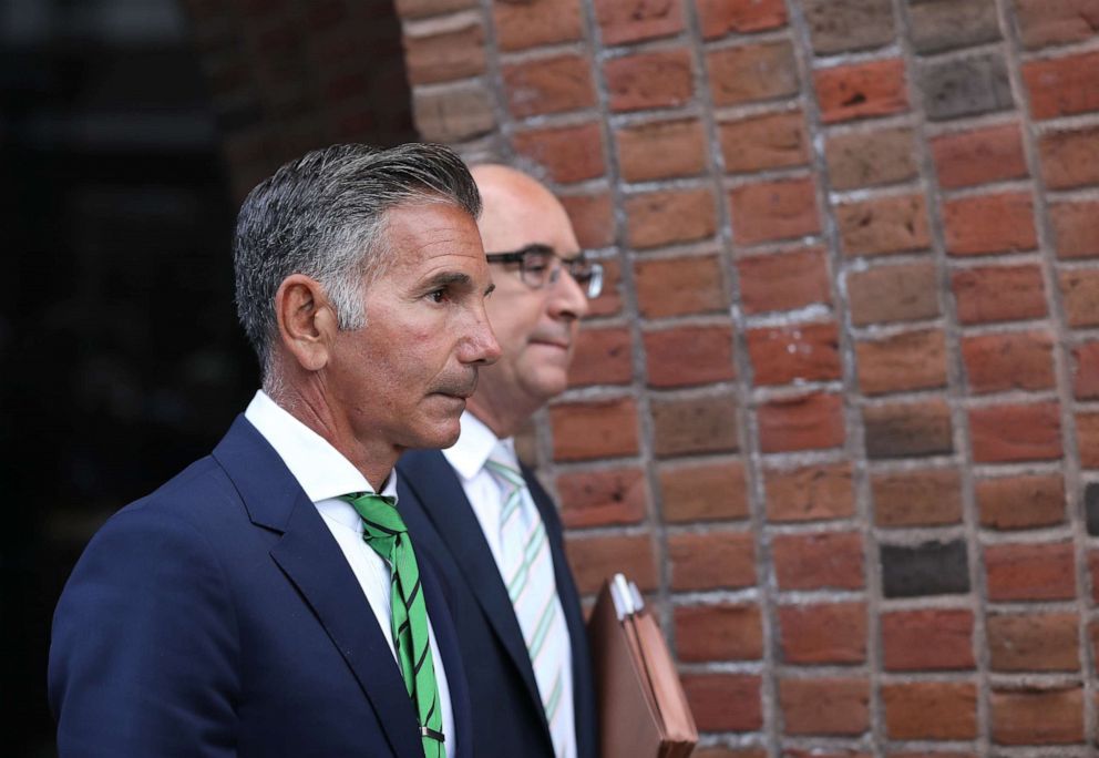 PHOTO: Mossimo Giannulli, left, husband of actress Lori Loughlin, follows her out of the John Joseph Moakley United States Courthouse in Boston on April 3, 2019.