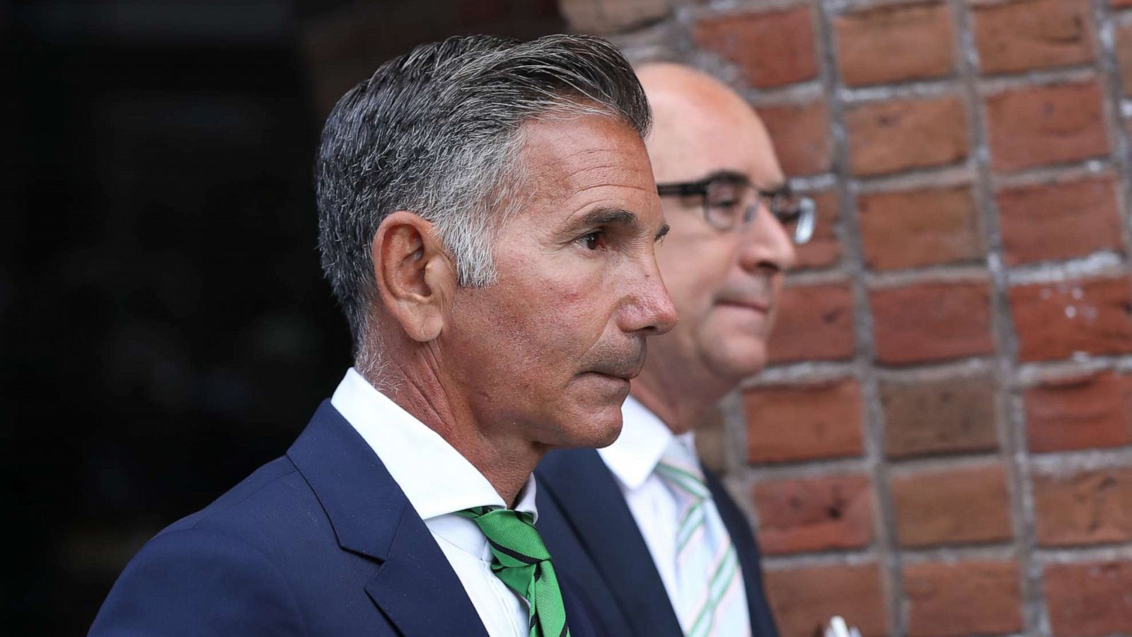 PHOTO: Mossimo Giannulli, left, husband of actress Lori Loughlin, follows her out of the courthouse in Boston, April 3, 2019.