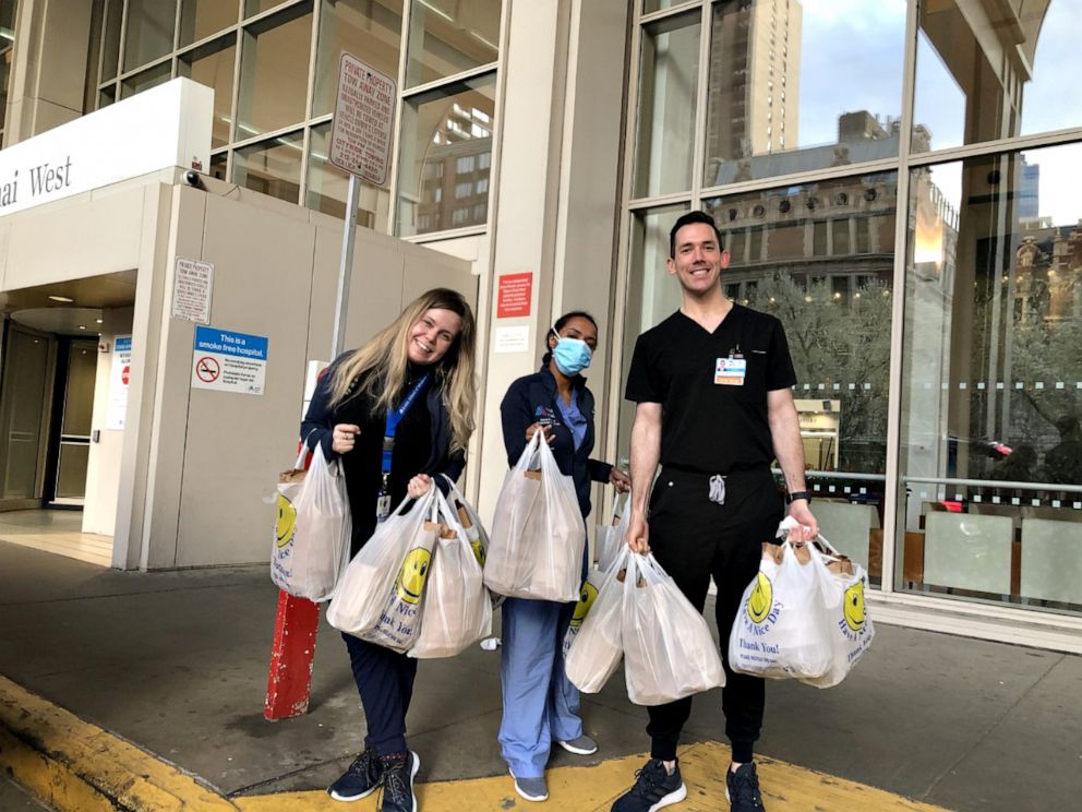 PHOTO: Medical workers at Mount Sinai West in New York City get 100 meals delivered from Thai Sliders on April 5, 2020.