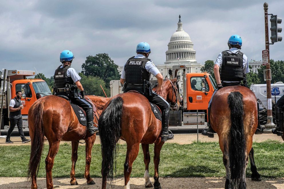 PHOTO: Horse mounted officers stand guard in front of the U.S. Capitol, Sept. 18, 2021.