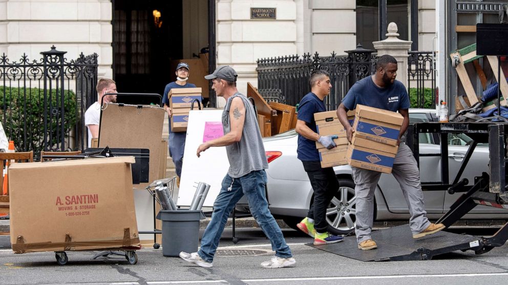 PHOTO: People carry boxes to a moving truck on the Upper East Side, as the city of New York continues Phase 4 of re-opening following restrictions imposed to slow the spread of Coronavirus on Aug. 29, 2020.  