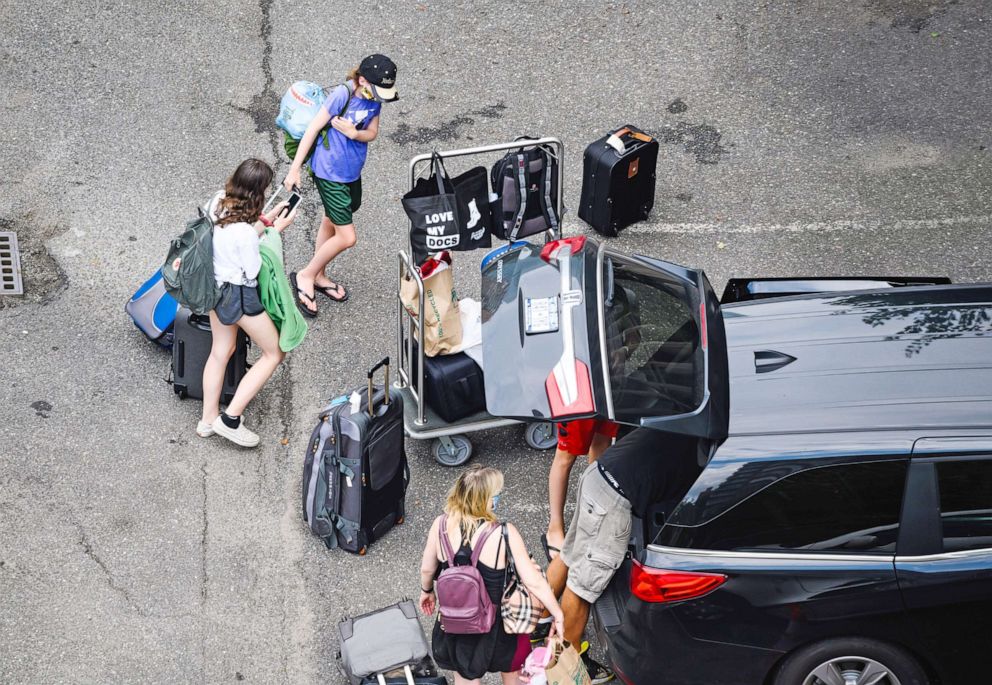 PHOTO: People load luggage into a car as the city continues Phase 3 of re-opening following restrictions imposed to slow the spread of Coronavirus in New York, July 11, 2020.