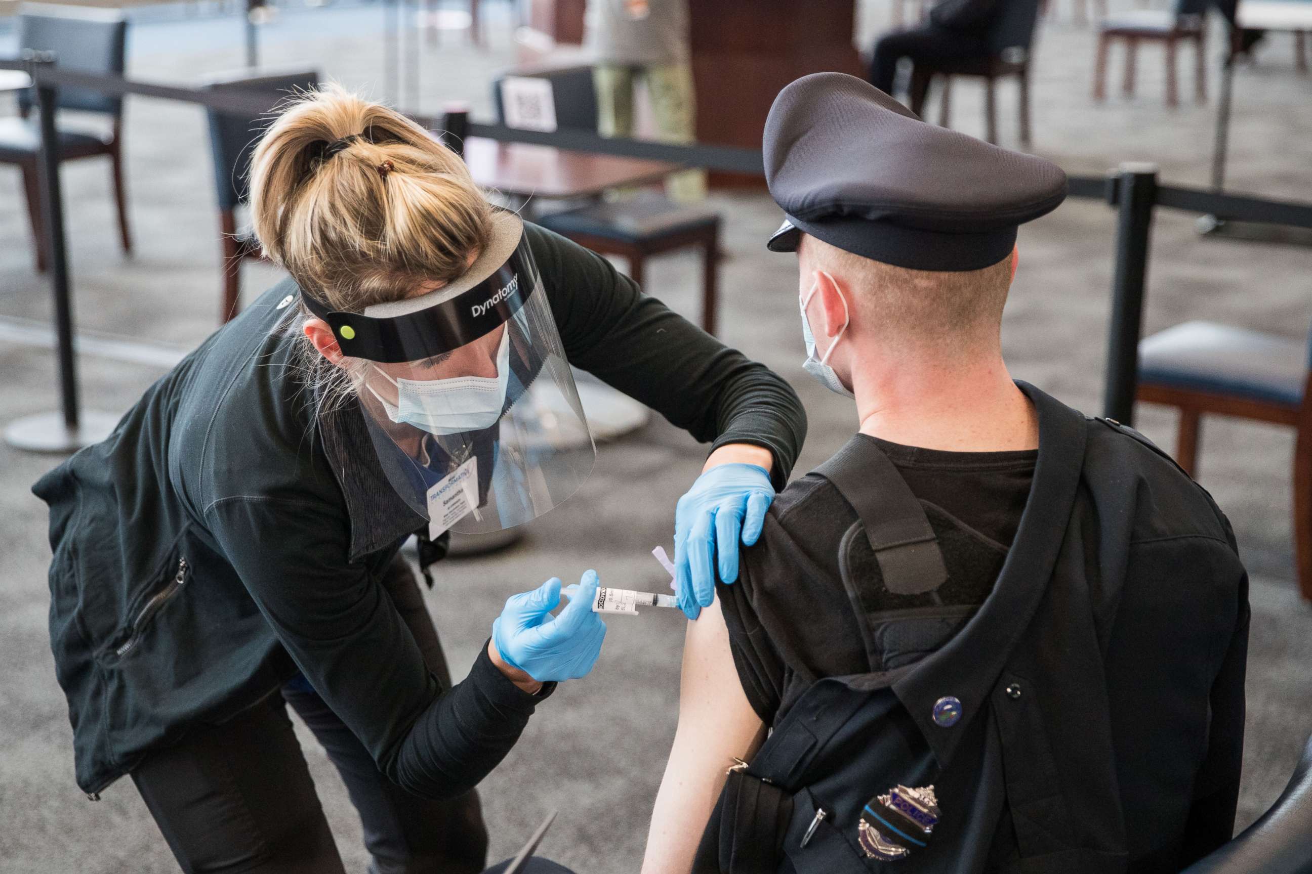 PHOTO: A police officer receives his COVID-19 vaccination at Gillette Stadium's vaccination site on Jan. 15, 2021 in Foxborough, Mass. 