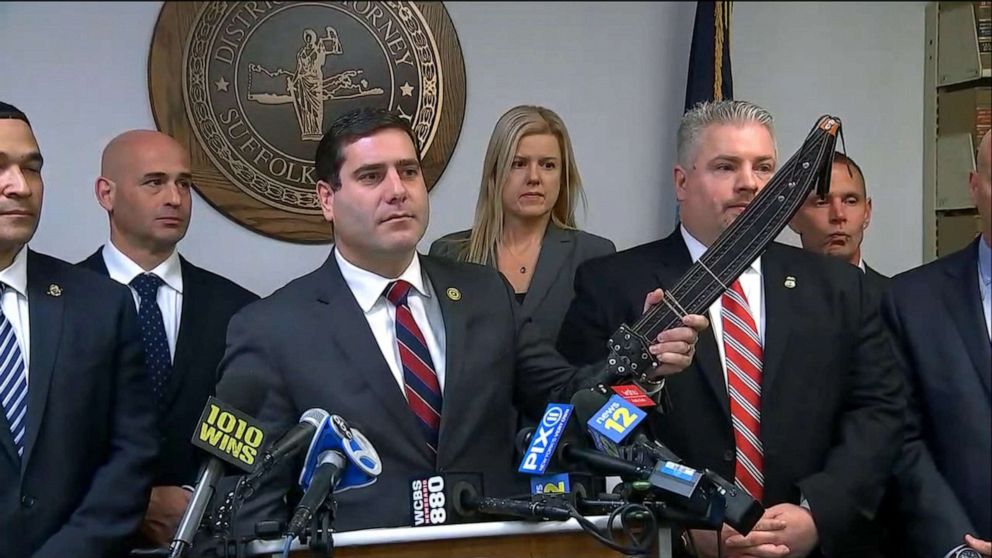 PHOTO: Suffolk County District Attorney Timothy Sini holds one of the "many machetes" recovered during the MS-13 investigation during a press conference, Dec. 20, 2019, in Riverhead, Long Island, New York.