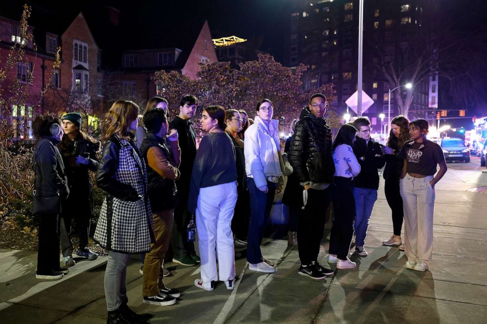 PHOTO: Students gather on the campus of Michigan State University after a shelter in place order was lifted early Feb. 14, 2023, in East Lansing, Mich.