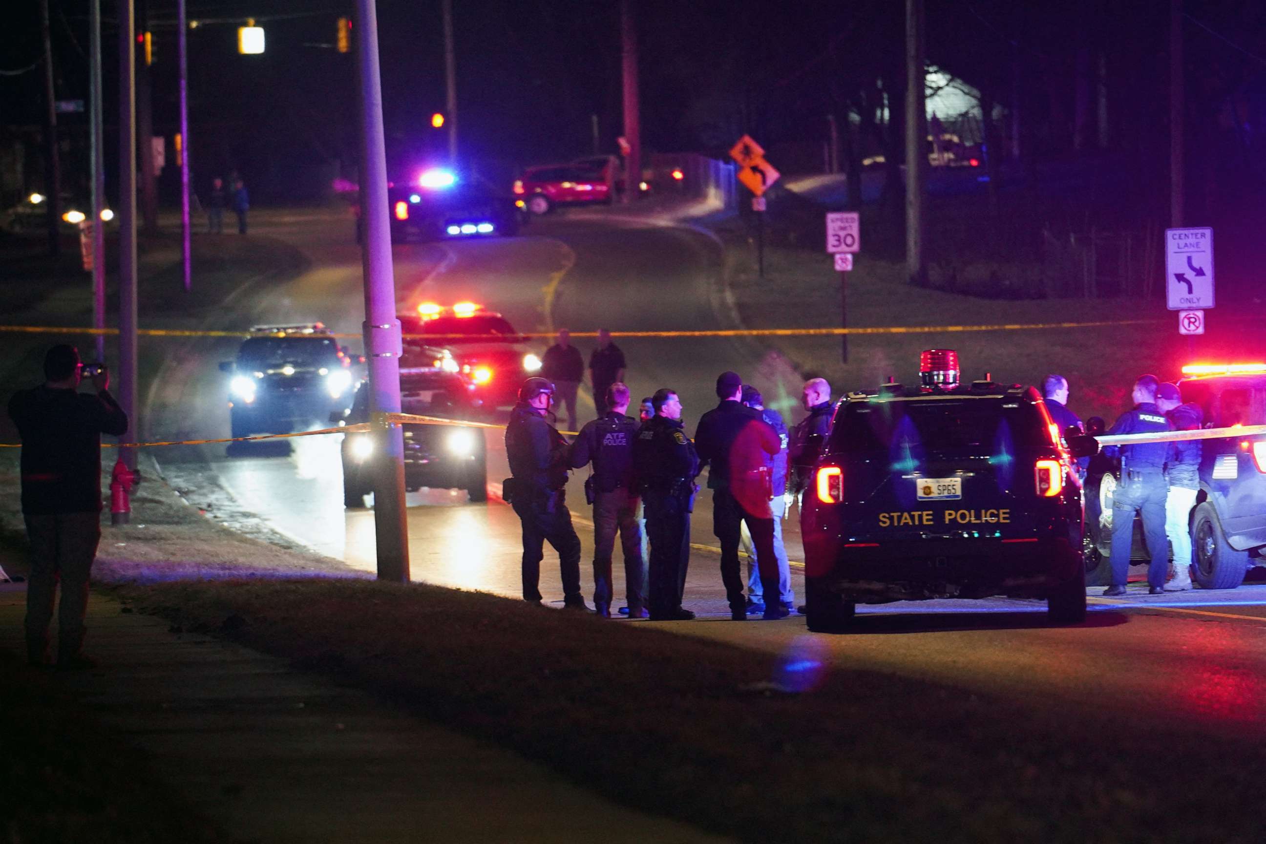 PHOTO: Police officers surround a scene where the suspect was located as they respond to a shooting at Michigan State University in East Lansing, Mich., Feb. 14, 2023.