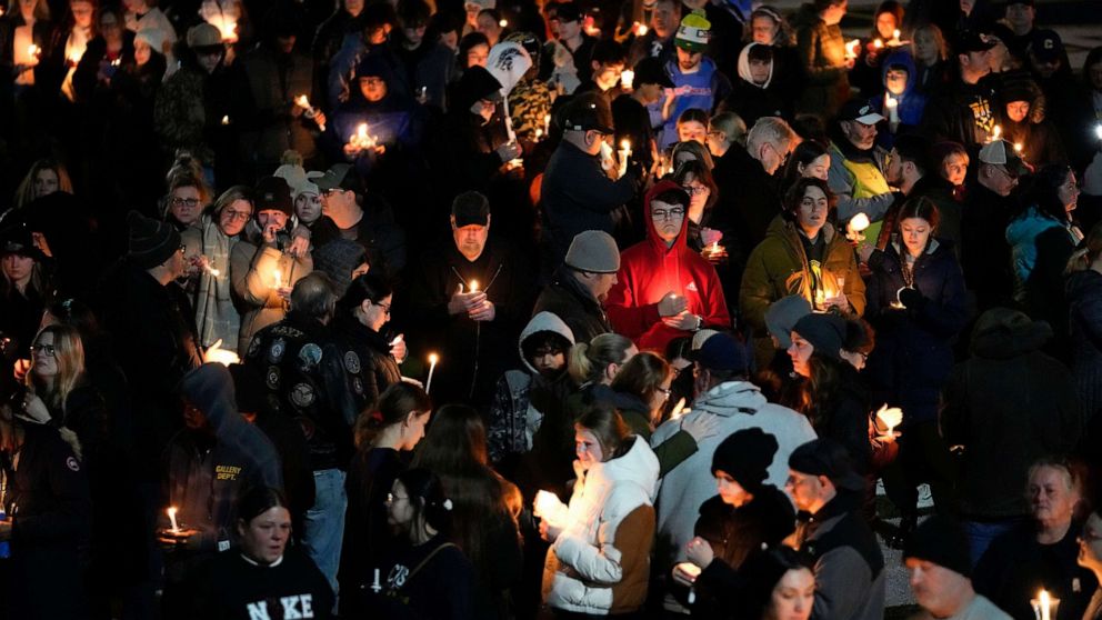 PHOTO: Mourners attend a candlelight vigil for Alexandria Verner at the Clawson High School football field in Clawson, Mich., Feb. 14, 2023.