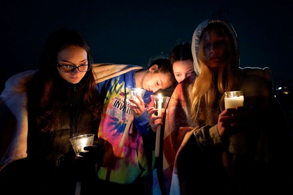 PHOTO: Mourners attend a candlelight vigil for Alexandria Verner at the Clawson High School football field in Clawson, Mich., Feb. 14, 2023.