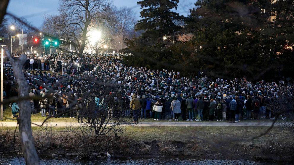 PHOTO: Mourners attend a vigil at The Rock on the grounds of Michigan State University in East Lansing, Mich., Feb. 15, 2023.