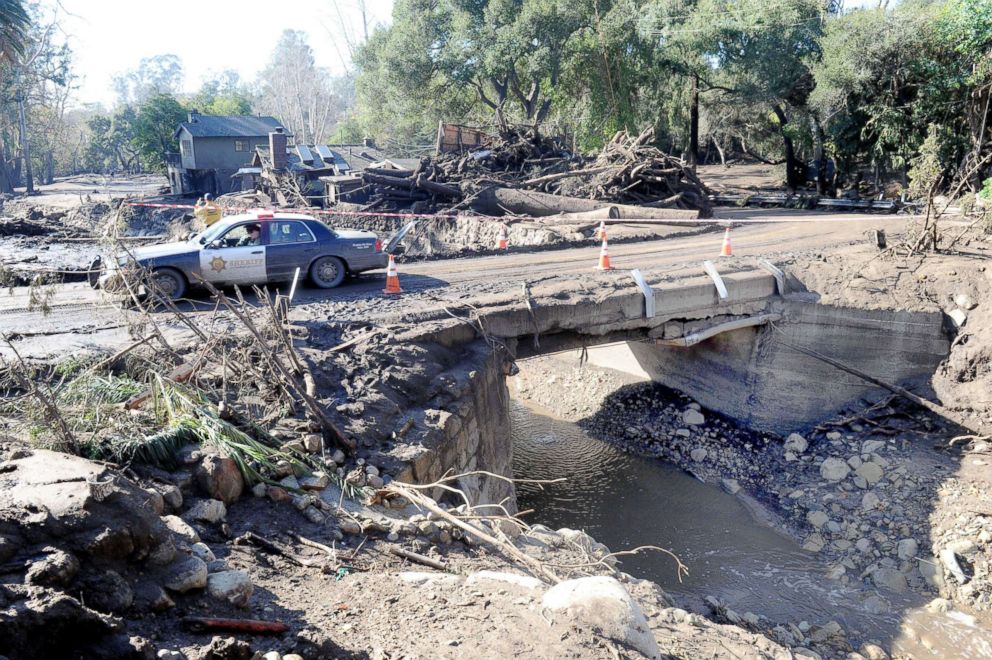 PHOTO: Police drive amid the devastation of a mudslide on East Valley Road in Montecito, Calif., on Jan. 11, 2018.