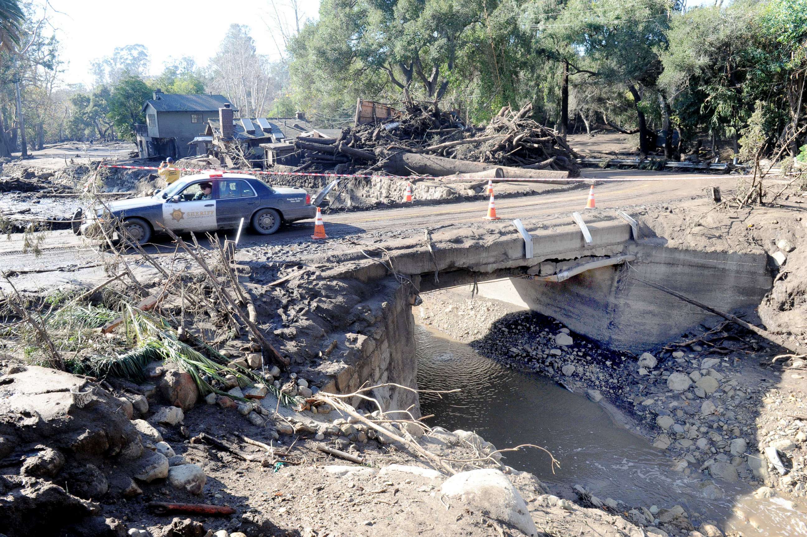 PHOTO: Police drive amid the devastation of a mudslide on East Valley Road in Montecito, Calif., on Jan. 11, 2018.