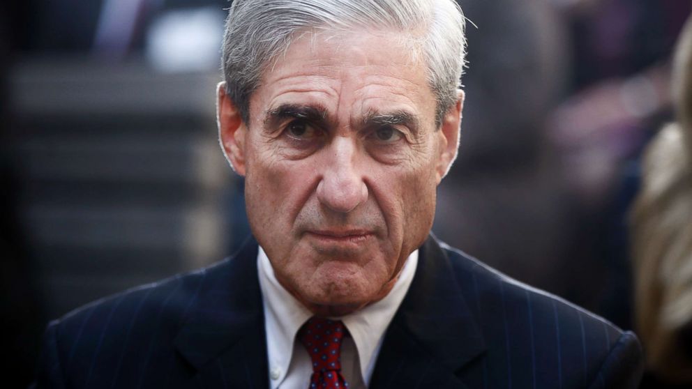 Robert Mueller is seated before President Barack Obama and FBI Director James Comey at an installation ceremony at FBI Headquarters in Washington, D.C.,  Oct. 28, 2013. 
