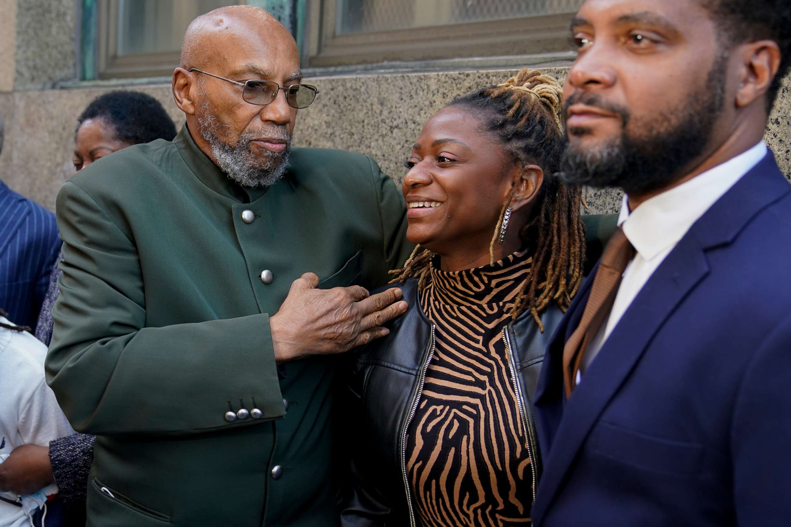 PHOTO: Muhammad Aziz, left, stands outside the courthouse with members of his family after his conviction in the killing of Malcolm X was vacated, Thursday, Nov. 18, 2021, in New York.
