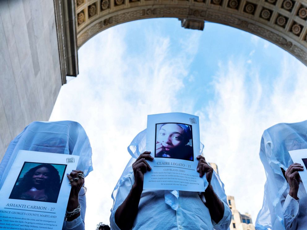 PHOTO: Transgender rights activists hold pictures of transgender women who were killed this year as they protest the recent killings of three transgender women during a rally at Washington Square Park in New York, May 24, 2019.