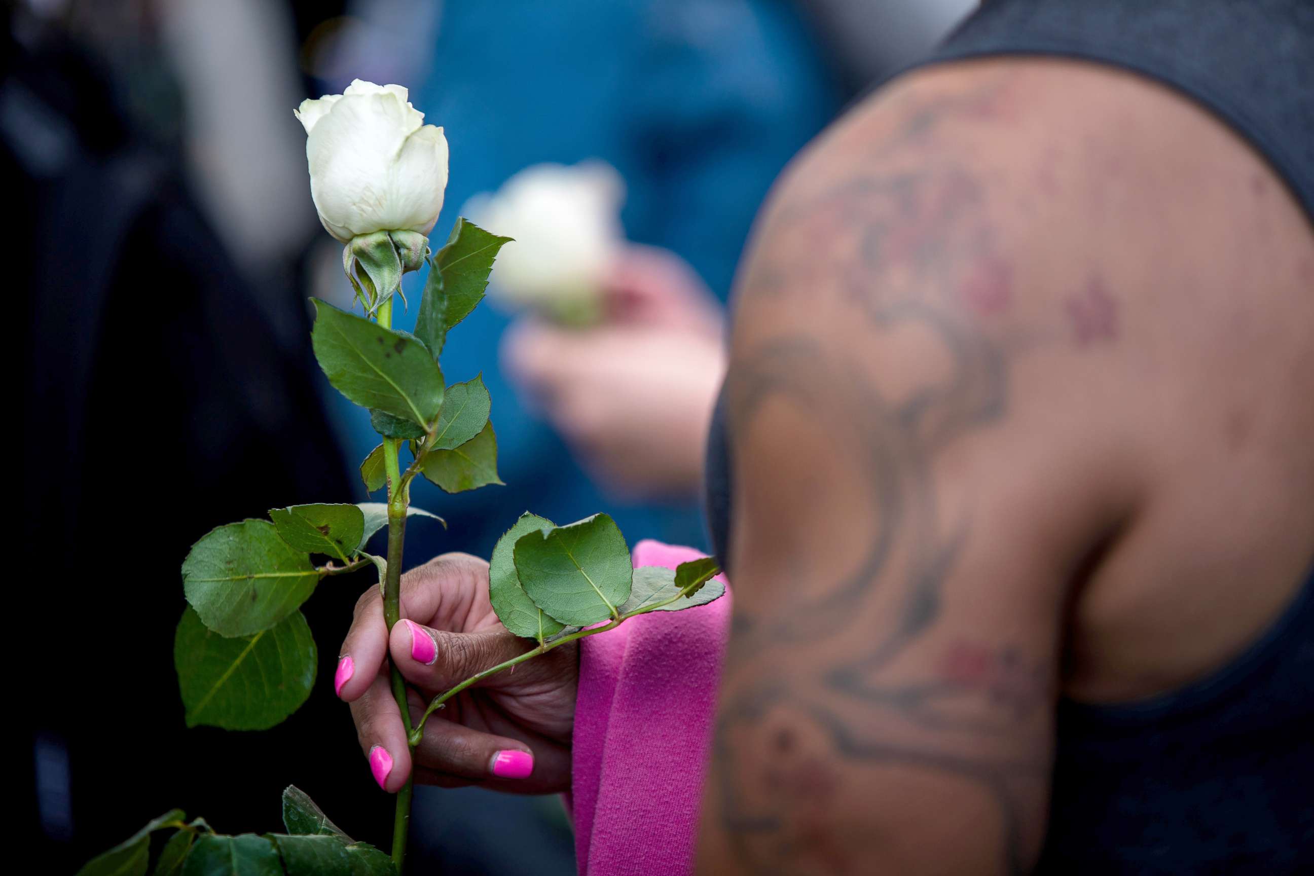 PHOTO: A transgender rights activist holds a white rose while protesting against the recent killings of three transgender women, Muhlaysia Booker, Claire Legato, and Michelle Washington, during a rally at Washington Square Park in New York, May 24, 2019.