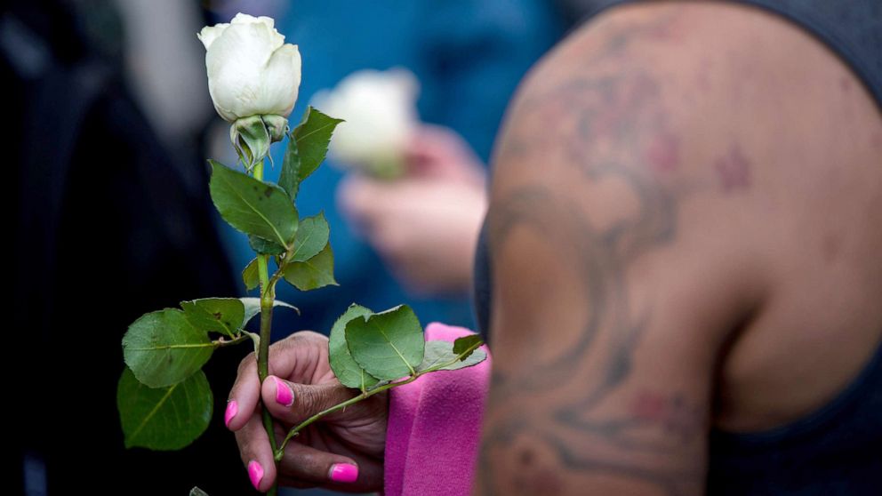 PHOTO: A transgender rights activist holds a white rose while protesting against the recent killings of three transgender women, Muhlaysia Booker, Claire Legato, and Michelle Washington, during a rally at Washington Square Park in New York, May 24, 2019.