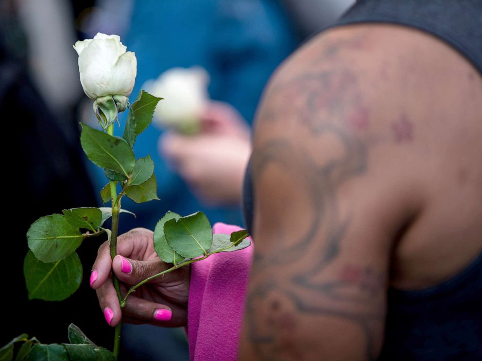 PHOTO: A transgender rights activist holds a white rose while protesting against the recent killings of three transgender women, Muhlaysia Booker, Claire Legato, and Michelle Washington, during a rally at Washington Square Park in New York, May 24, 2019.