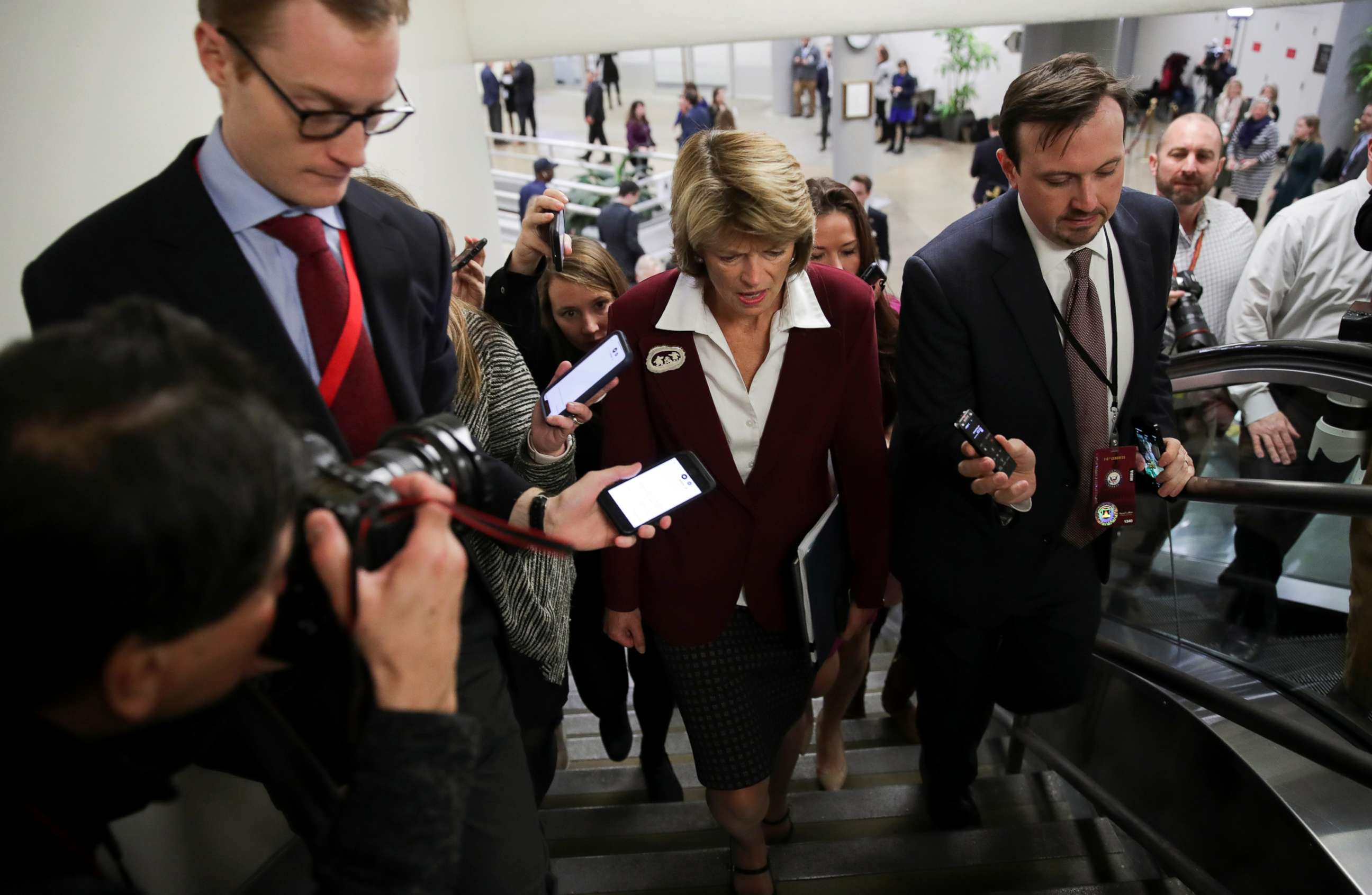 PHOTO: Senator Lisa Murkowski is surrounded by reporters as she arrives for the Senate impeachment trial of President Donald Trump at the Capitol in Washington, Jan. 28, 2020.
