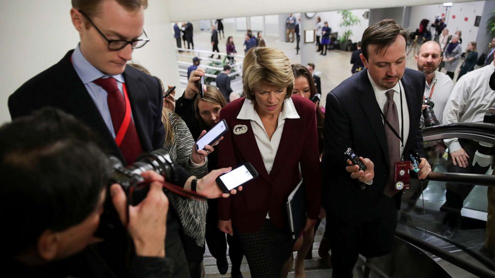 PHOTO: Senator Lisa Murkowski is surrounded by reporters as she arrives for the Senate impeachment trial of President Donald Trump at the Capitol in Washington, Jan. 28, 2020.