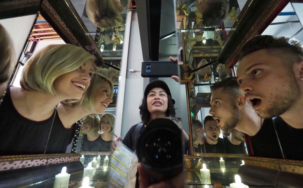 PHOTO: Visitors explore artist Matt Elson's infinity box entitled "You And Me Together," at the Museum of Selfies, in Glendale, Calif., March 29, 2018.