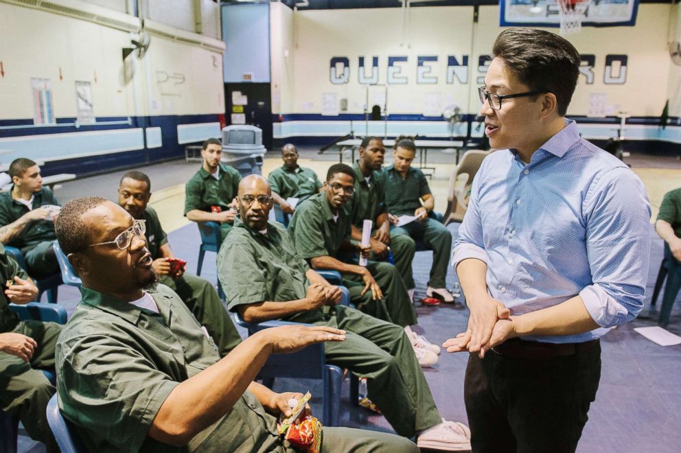 PHOTO: Ensemble Connect fellow Brandon Ilaw speaking with inmates at Queensboro Correctional Facility. 