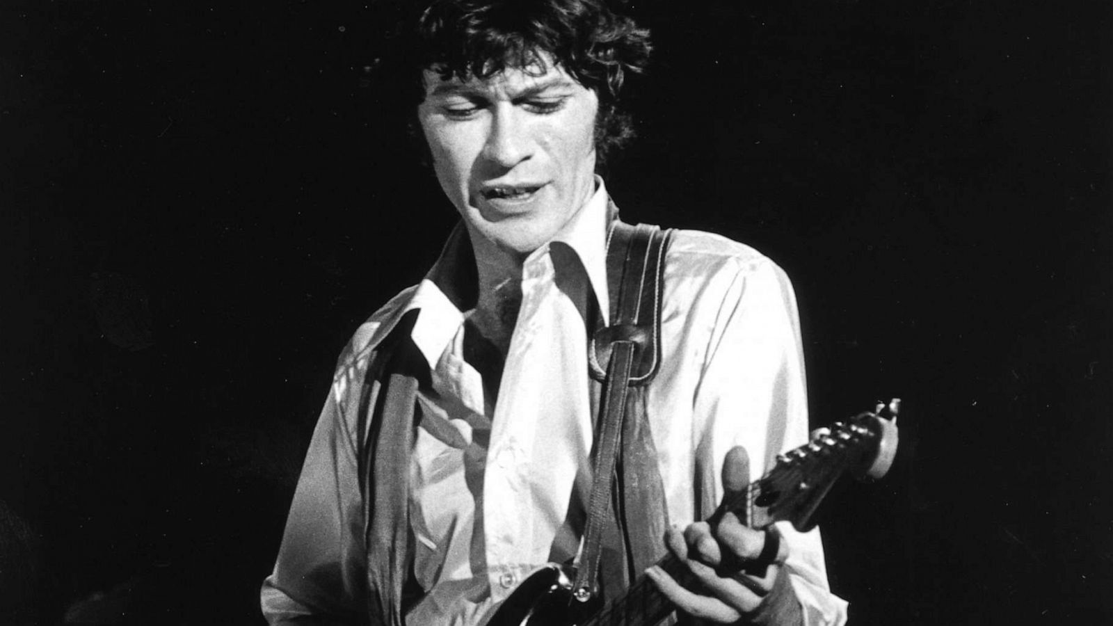 PHOTO: FILE - Robbie Robertson of the rock group "The Band" performs onstage at "The Last Waltz" concert with his Fender Stratocaster electric guitar, Nov 25, 1976 in San Francisco.