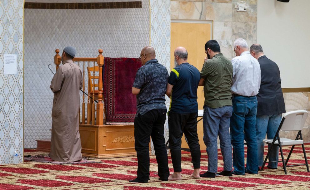 PHOTO: An Imam leads a group of men during the Dhuhr afternoon prayer at the Islamic Center of New Mexico on Aug. 7, 2022, after the fourth Muslim man was murdered in Albuquerque.