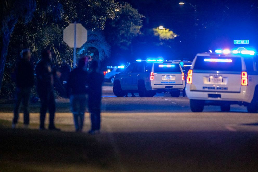 PHOTO: People gather near the site of a shooting in Myrtle Beach, S.C., Oct. 3, 2020.