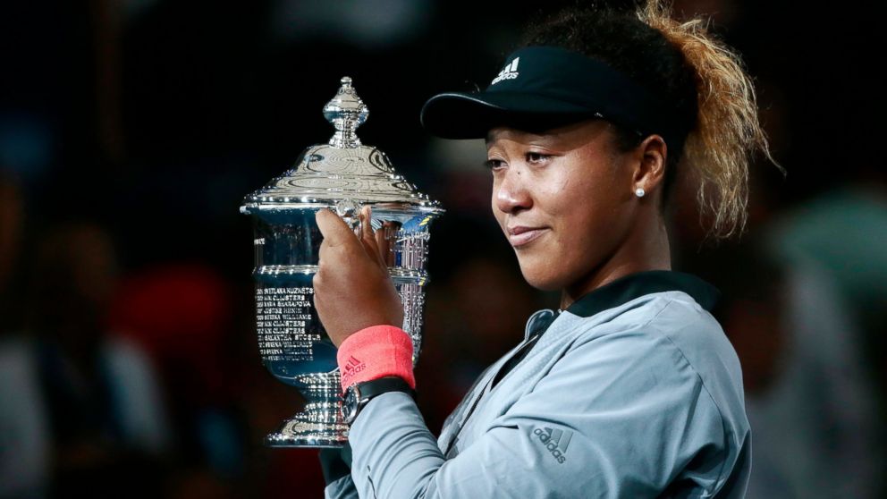 Naomi Osaka, of Japan, holds the trophy after defeating Serena Williams in the women's final of the U.S. Open tennis tournament, Saturday, Sept. 8, 2018, in New York.