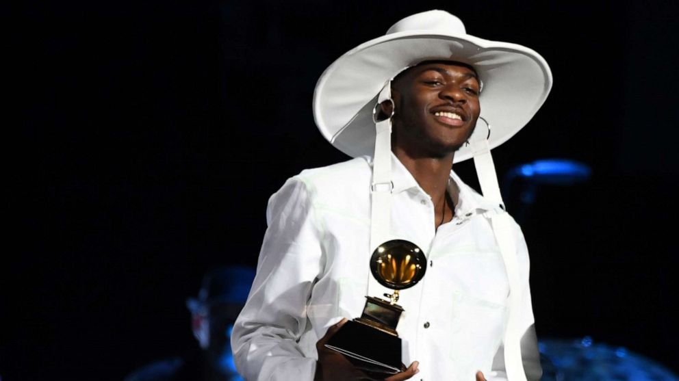 PHOTO: Lil Nas X arrives to accept the award for best Music Video for "Old Town Road" during the 62nd Annual Grammy Awards pre-telecast show on January 26, 2020, in Los Angeles.