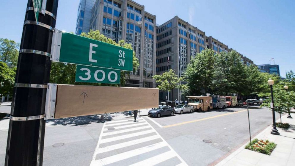 PHOTO: A covered street sign is seen outside of the NASA Headquarters building the day before a street renaming ceremony, June 11, 2019, in Washington, D.C.