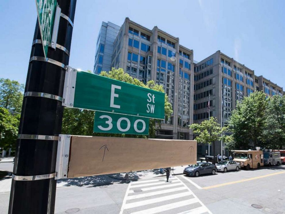 PHOTO: A covered street sign is seen outside the NASA headquarters building on the eve of a street name change ceremony, on June 11, 2019, in Washington, DC.