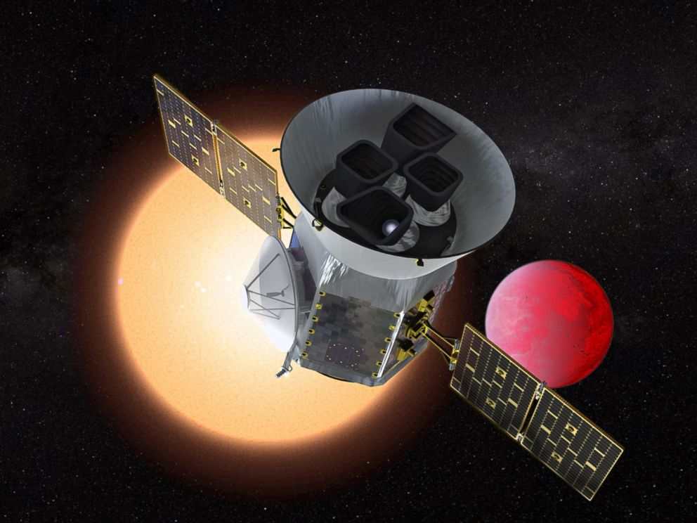 PHOTO: An artists depiction shows NASAs Transiting Exoplanet Survey Satellite in front of a lava planet orbiting its host star.
