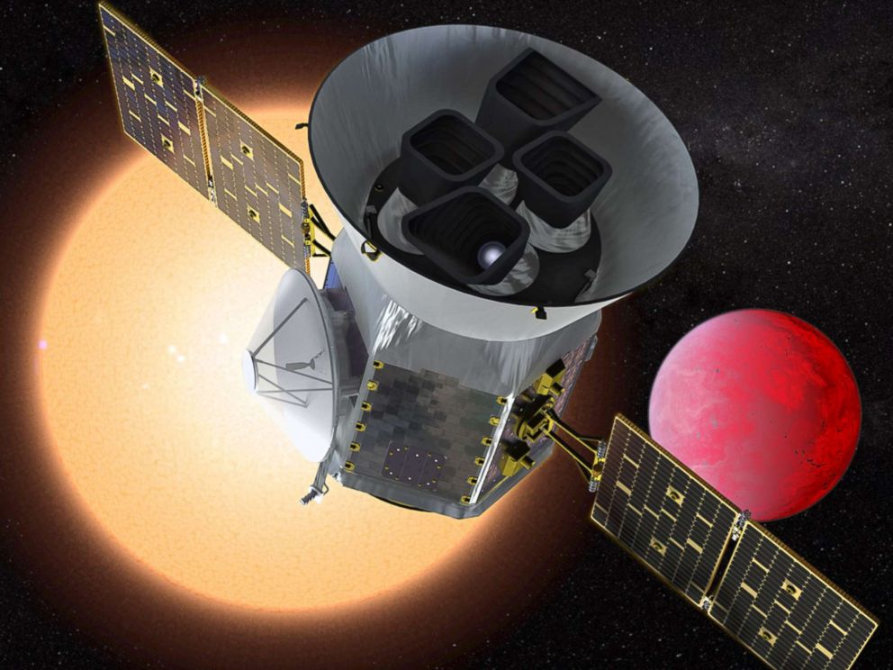 PHOTO: An artist's depiction shows NASA's Transiting Exoplanet Survey Satellite in front of a lava planet orbiting its host star.