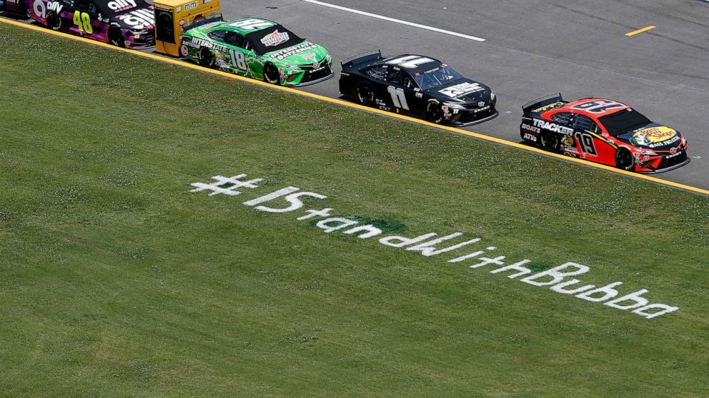 PHOTO: A sign is painted along the pit road in the grass reading, "#IStandWithBubba" prior to the NASCAR Cup Series GEICO 500 at Talladega Superspeedway, June 22, 2020 in Talladega, Ala.