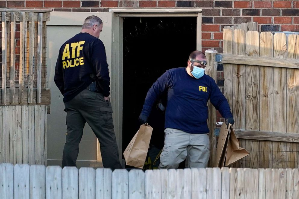 PHOTO: Investigators remove items from the basement of a home Saturday, Dec. 26, 2020, in Nashville, Tenn. An explosion that shook downtown Nashville Christmas morning shattered windows, damaged buildings and wounded three people.