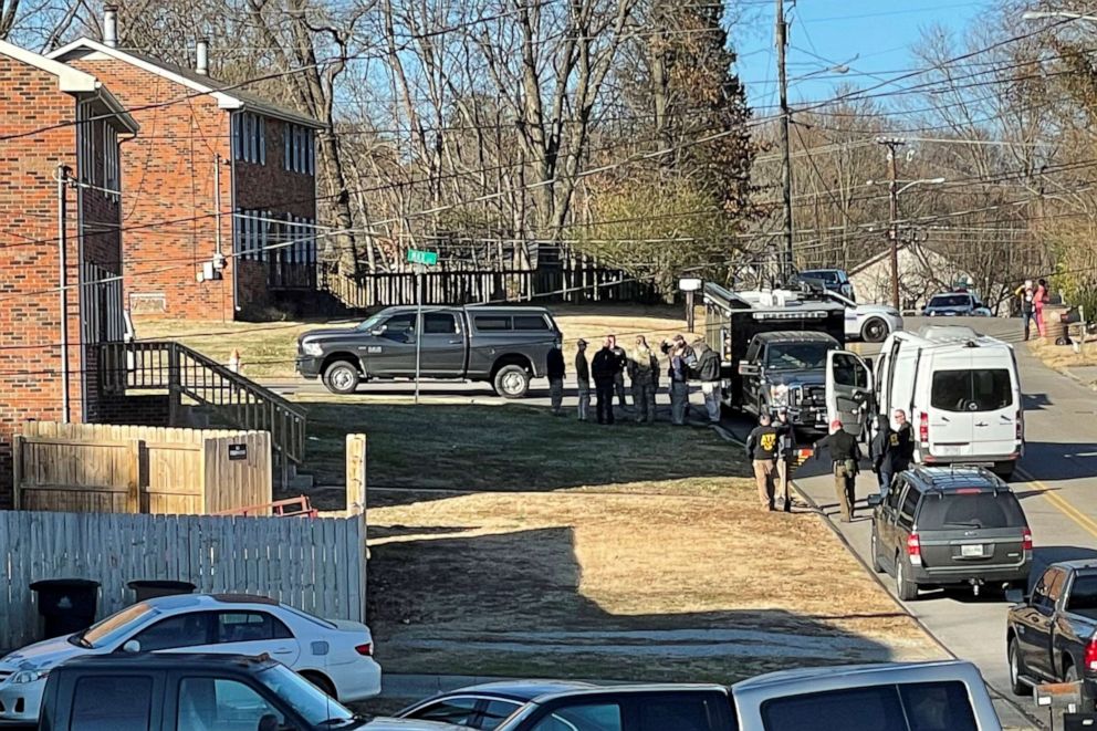 PHOTO: Law enforcement officers gather to investigate information arising the day after a downtown Nashville explosion, outside a duplex house in Antioch, Tenn., Dec. 26, 2020.