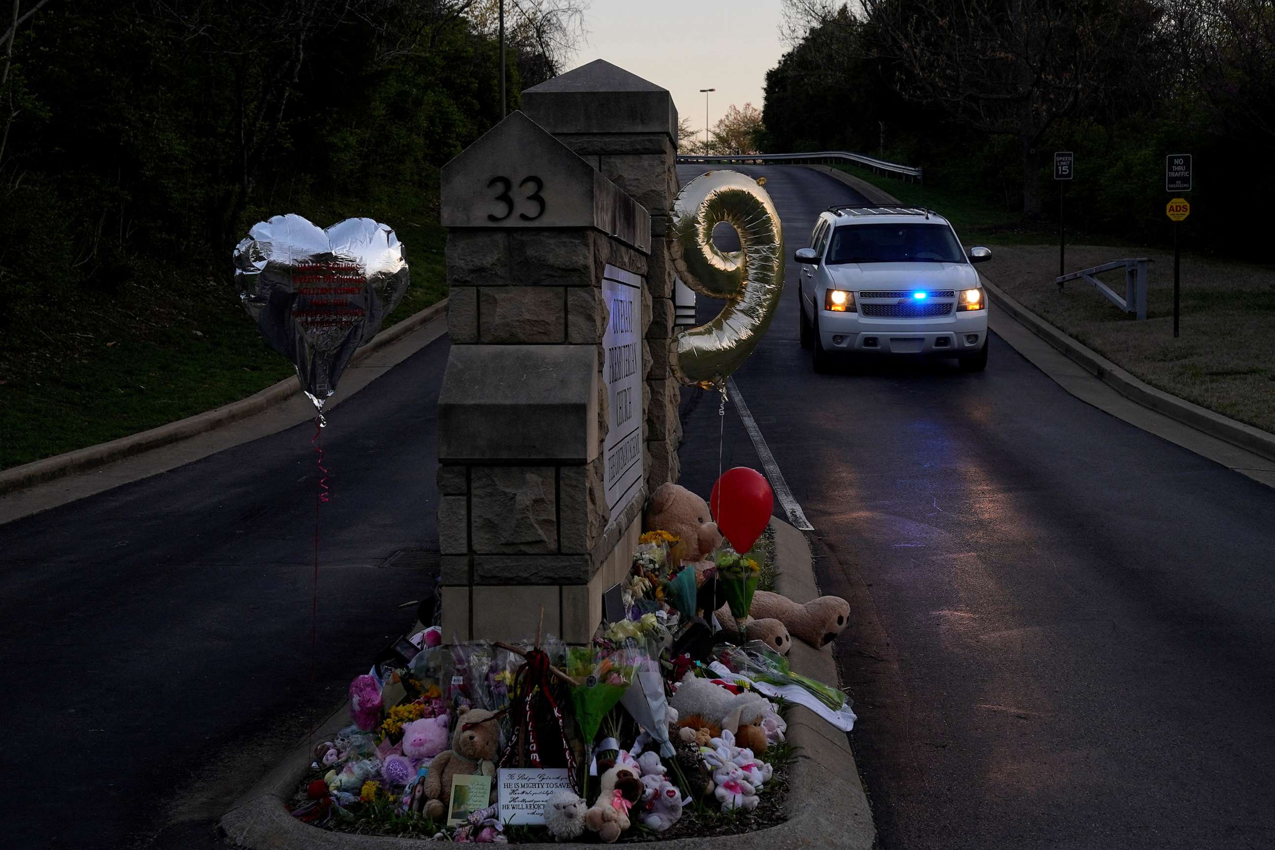 PHOTO: A balloon in the shape of the number nine, representing the age of some of victims, is seen at a memorial at the school entrance after a deadly shooting at the Covenant School in Nashville, Tenn., March 29, 2023.