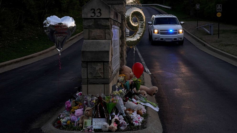 PHOTO: A balloon in the shape of the number nine, representing the age of some of victims, is seen at a memorial at the school entrance after a deadly shooting at the Covenant School in Nashville, Tenn., March 29, 2023.