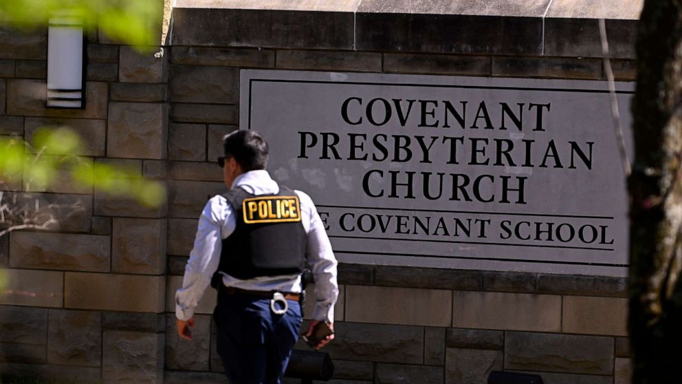 PHOTO: A police officer walks by an entrance to The Covenant School after a shooting in Nashville, Tenn., March 27, 2023.