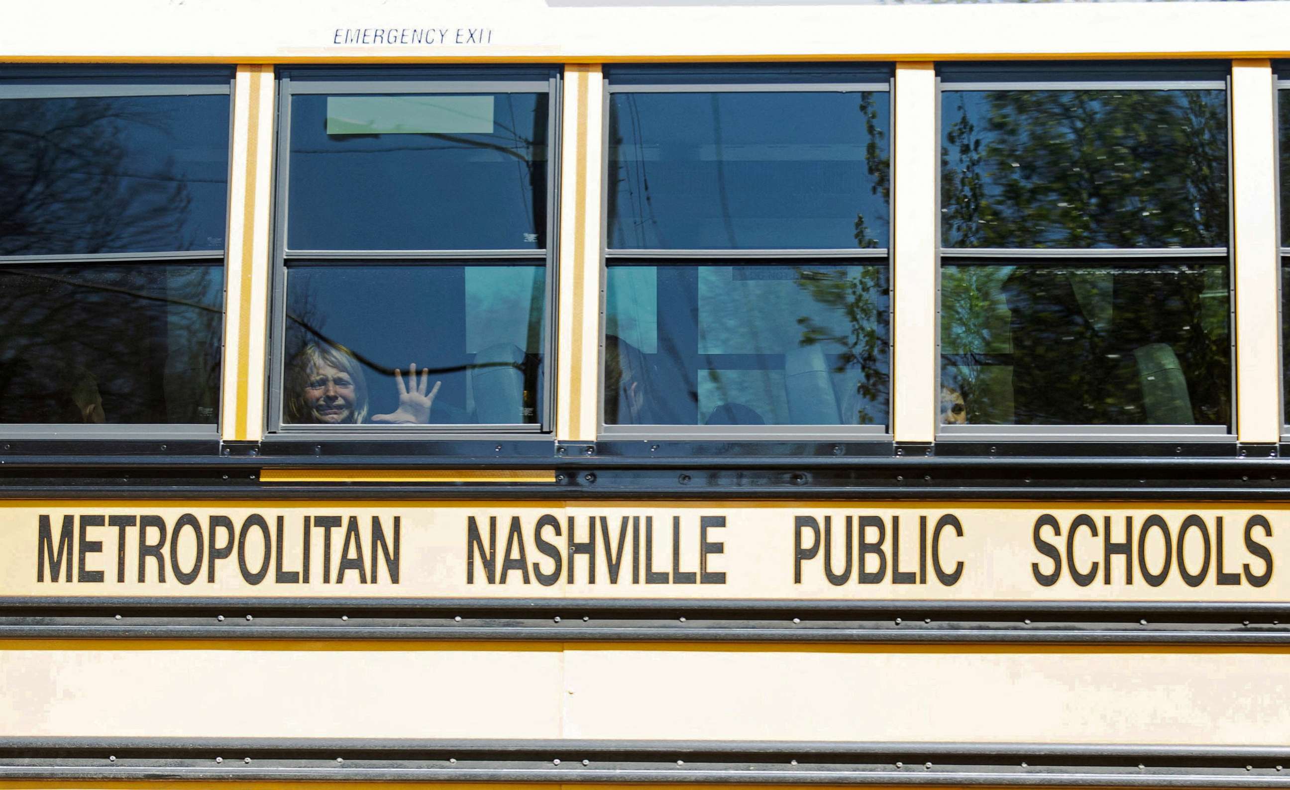 PHOTO: A child weeps while on a bus leaving The Covenant School, following a mass shooting at the school in Nashville, Tenn., Mar. 27, 2023.