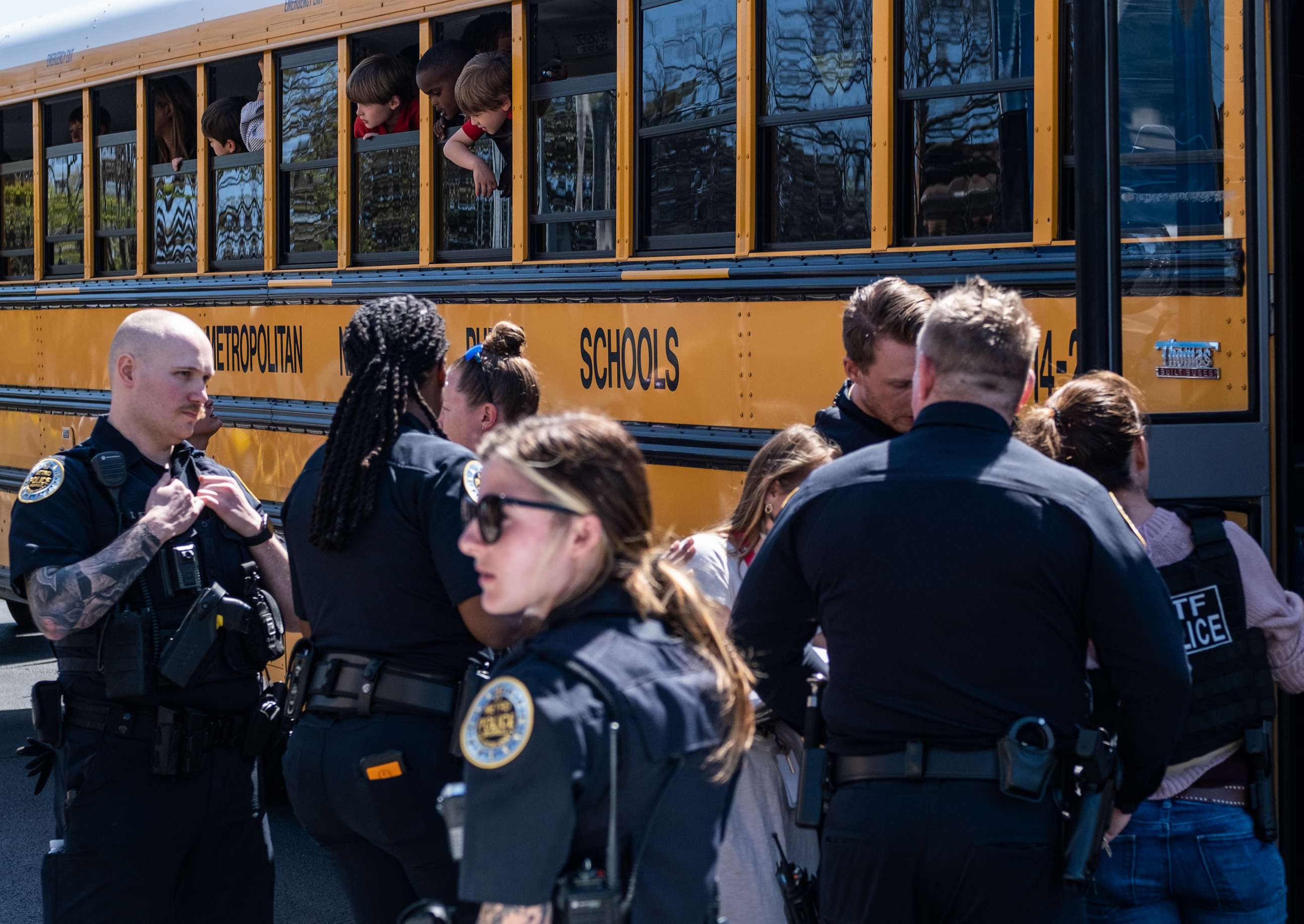 PHOTO: School buses with children arrive at Woodmont Baptist Church to be reunited with their families after a mass shooting at The Covenant School, Mar. 27, 2023, in Nashville, Tenn.