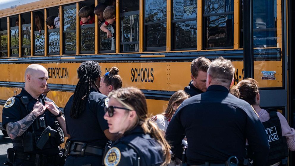 PHOTO: School buses with children arrive at Woodmont Baptist Church to be reunited with their families after a mass shooting at The Covenant School, Mar. 27, 2023, in Nashville, Tenn.