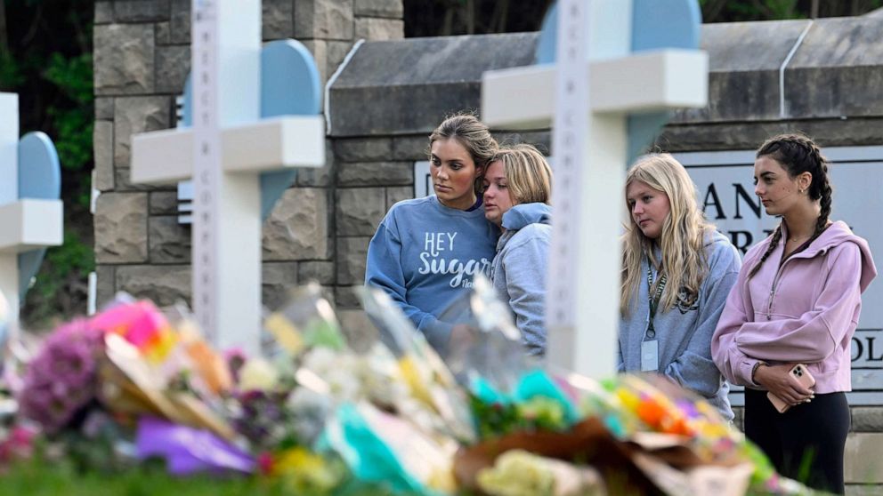 PHOTO: FILE - Students at a nearby school pay respects at a memorial for the people who were killed, at an entry to Covenant School, March 28, 2023, in Nashville, Tenn.