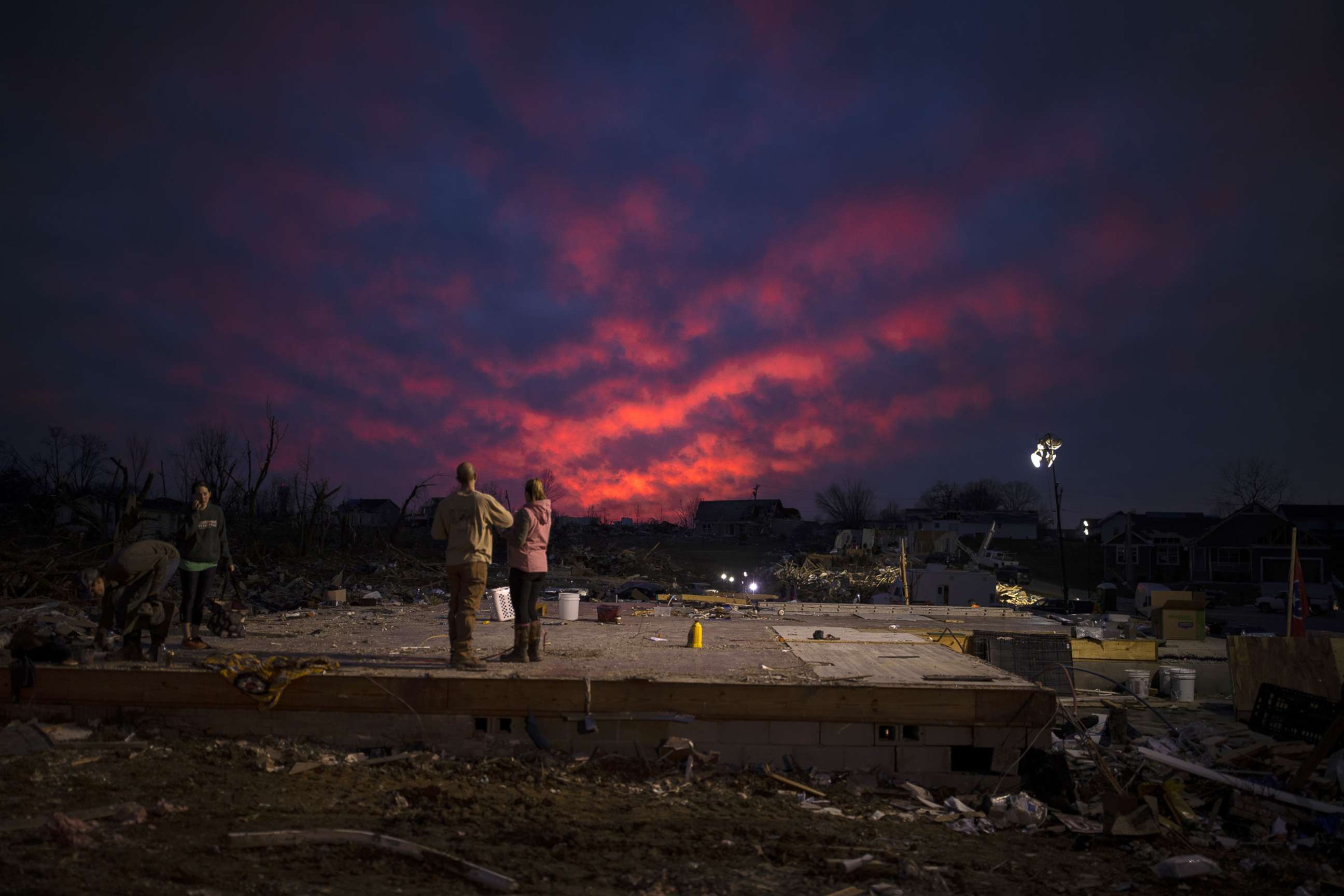 PHOTO: The sun sets on March 4, 2020,  behind the foundation of a home left after a tornado touched down the day before, in Cookeville, Tenn.